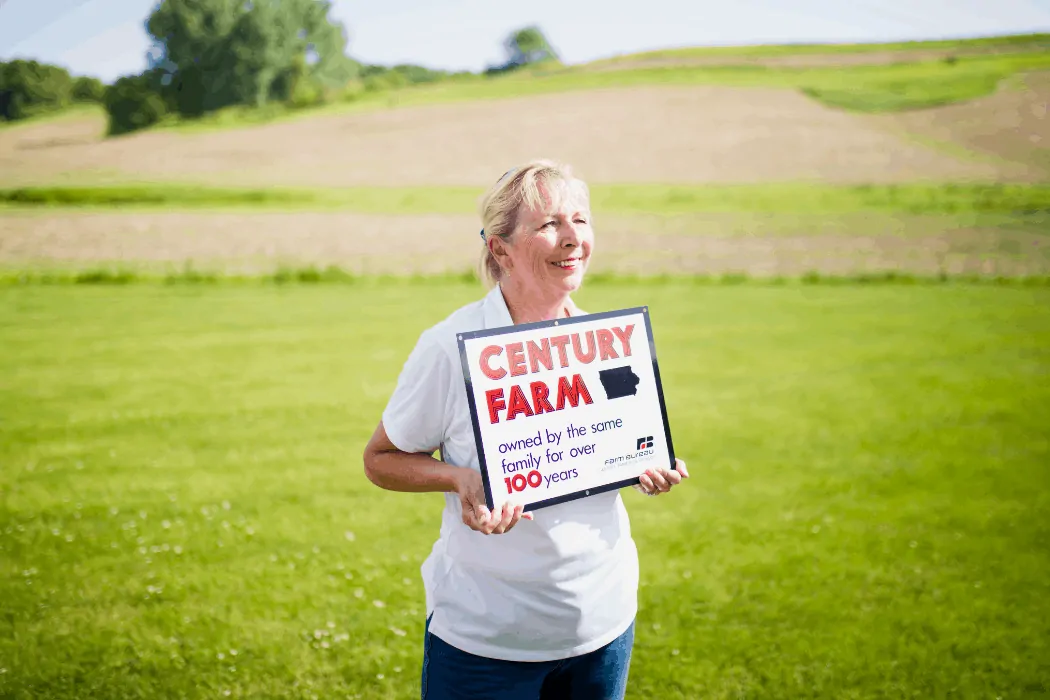 Sara Wyant proudly standing on her century family farm. 