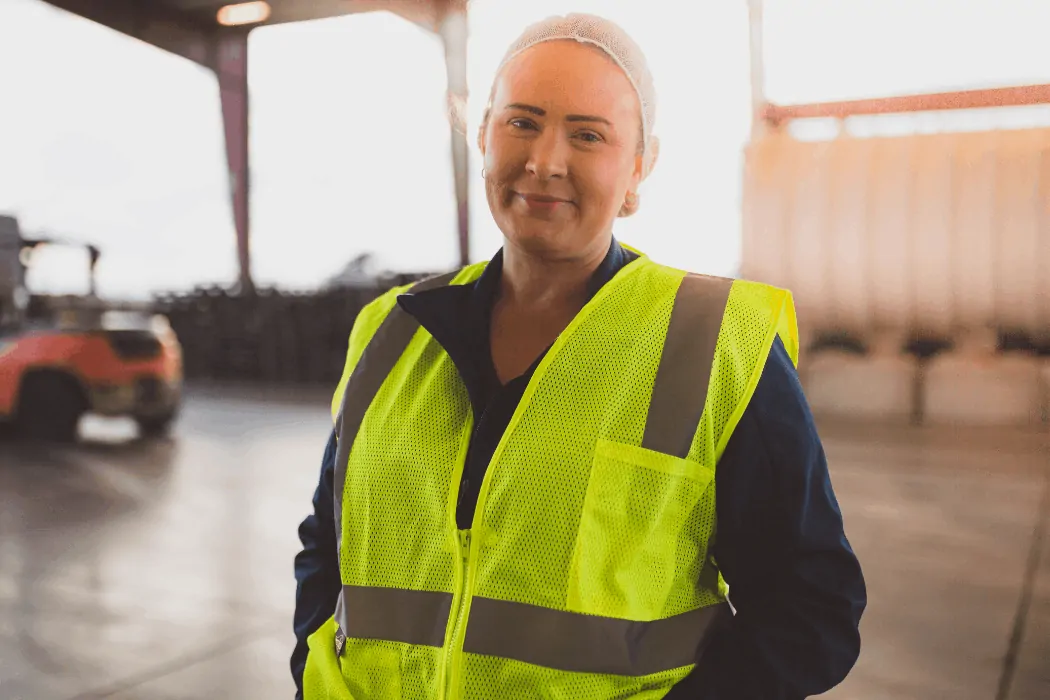 Stephanie stands in warehouse that she helps manage at Duncan Farms.