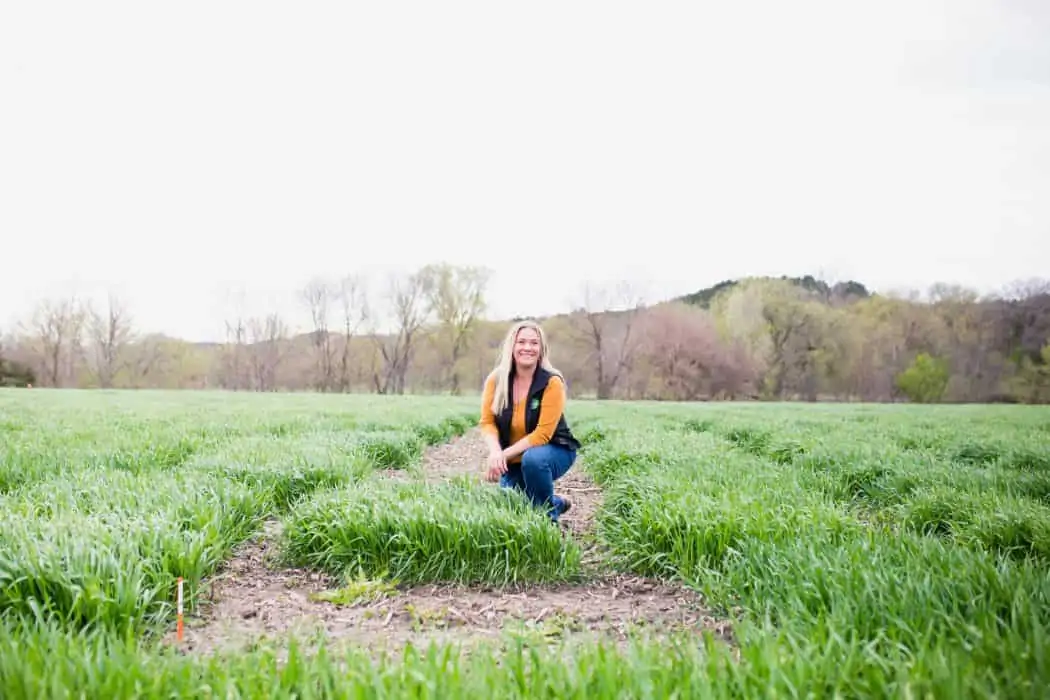 Jami Loecker, problem solver and Agronomy Manager for Syngenta standing in a field in Kansas.